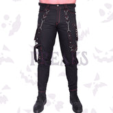 Black gothic pants with red stitching, silver chains, pyramid studs