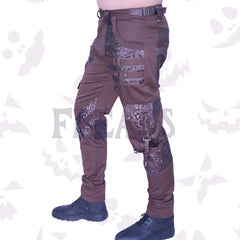 Brown gothic slim fit pants with leather baroque-patterned accents, straps, and buckles.